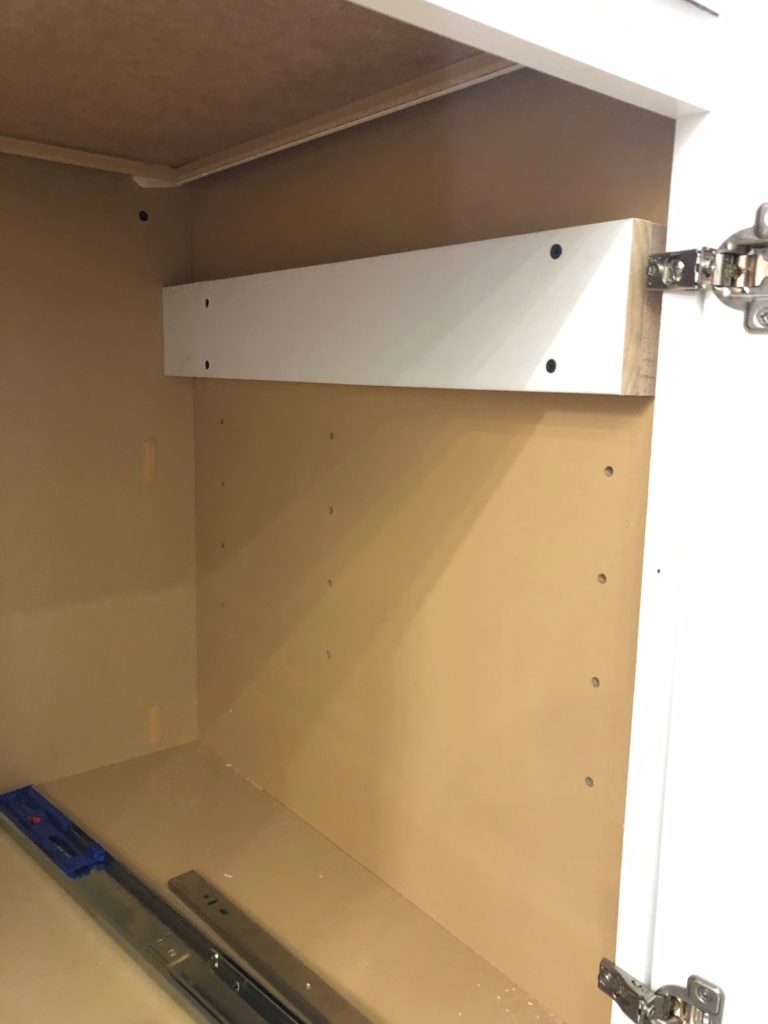 https://www.frillsanddrills.com/wp-content/uploads/2019/09/diy_hanging_file_drawer_in_kitchen_cabinet_-3-768x1024.jpg